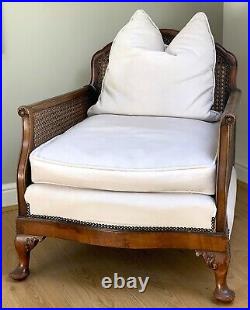 Beautiful vintage antique bergere chair, elegant & newly reupholstered in cream