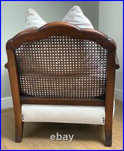 Beautiful vintage antique bergere chair, elegant & newly reupholstered in cream