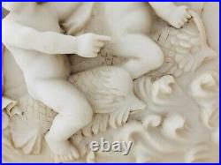 French vintage mirror with alabaster cherubs plague and carved wooden frame