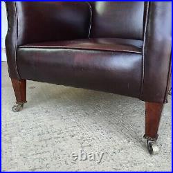 Vintage 1930s burgundy leather small library armchair wood legs casters chair
