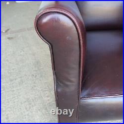 Vintage 1930s burgundy leather small library armchair wood legs casters chair