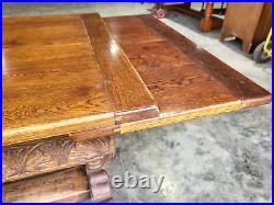 Vintage 20thC Carved Oak Extending Refectory Pedestal Dining Table Draw Leaf
