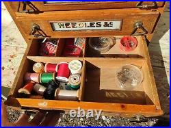 Vintage oak Haberdashery advertising cabinet and contents. Needles and co