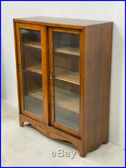 Vintage solid glazed oak bookcase cabinet with sliding doors -Delivery Available