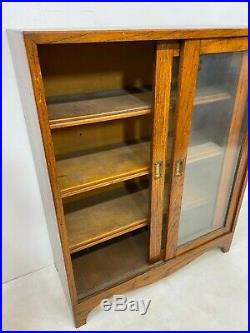 Vintage solid glazed oak bookcase cabinet with sliding doors -Delivery Available